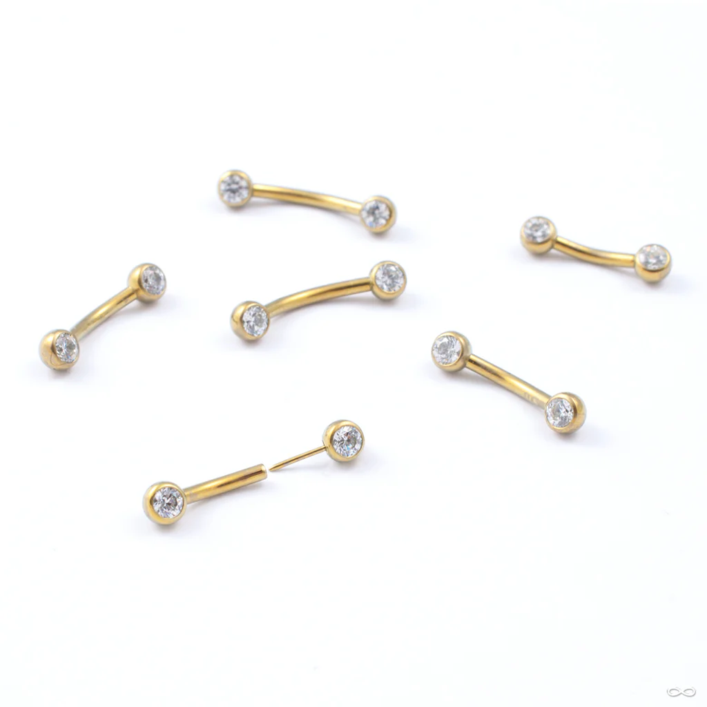 Curved Press-fit Post with Side-set Stones in Titanium Anodized Gold from Neometal